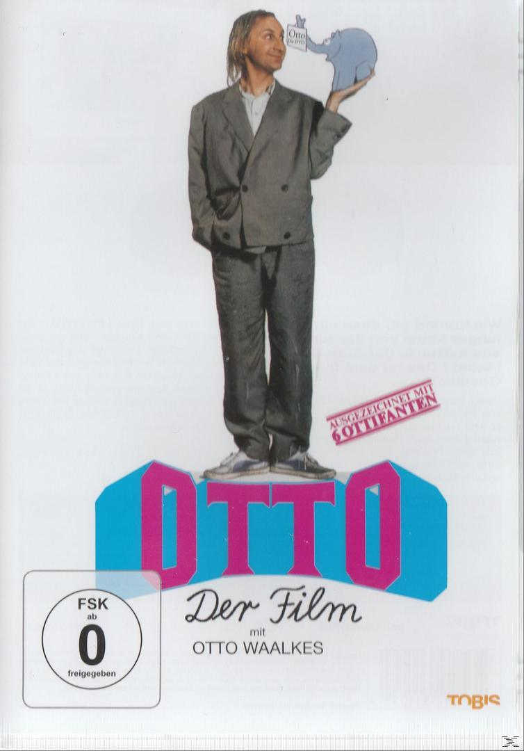 Mann im grauen Anzug steht auf 'OTTO'-Zeichen. Er hält einen blauen Elefanten. Deutsche DVD-Hülle, 'Otto, Der Film'.