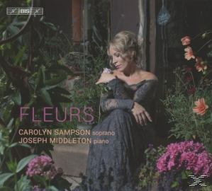Albumcover mit Frau in schwarzem Kleid, floralem Hintergrund, rosa Blumen, Titel 'FLEURS'.