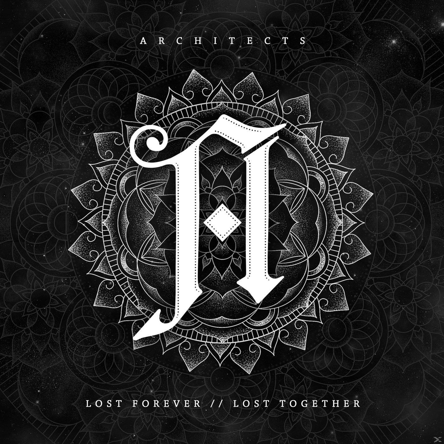 Albumcover mit einem weißen Buchstaben 'A' in einem Mandala-Design auf schwarzem Hintergrund.