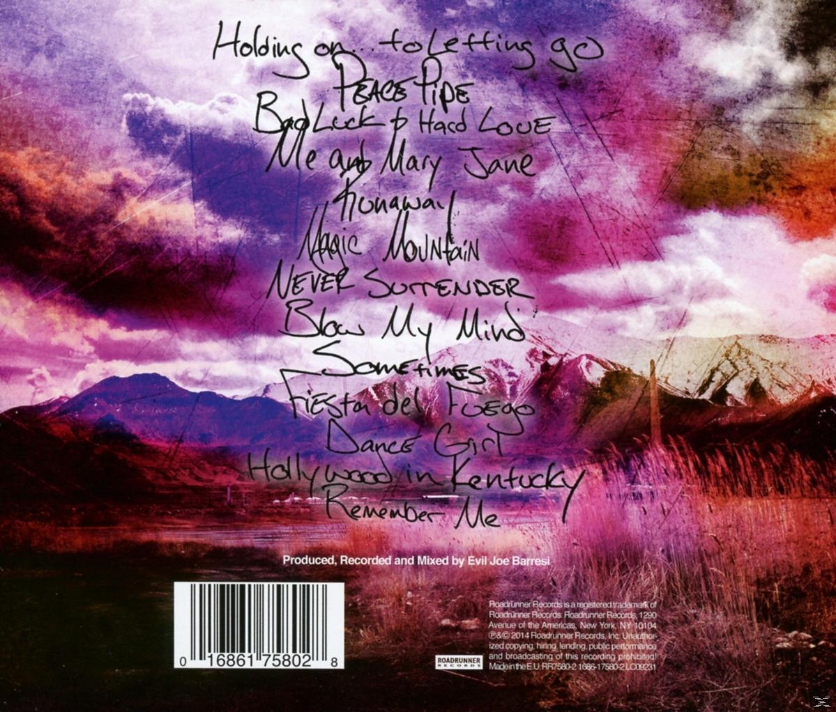 Album-Rückseite mit handgeschriebenen Songtiteln, lila und rosa Himmel über Bergen. Albumdetails unten.