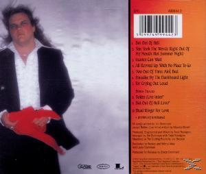 Album-Rückseite mit einem Mann, der ein rotes Objekt hält. Text mit Trackliste und Credits.