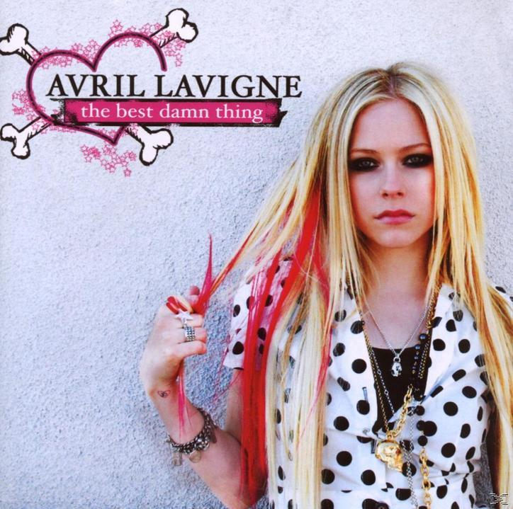 Avril Lavigne Albumcover. Sie hält ihr Haar mit roten Strähnen. Hintergrund ist ein pinkfarbener Totenkopf. Sie trägt ein Polka-Dot-Shirt.