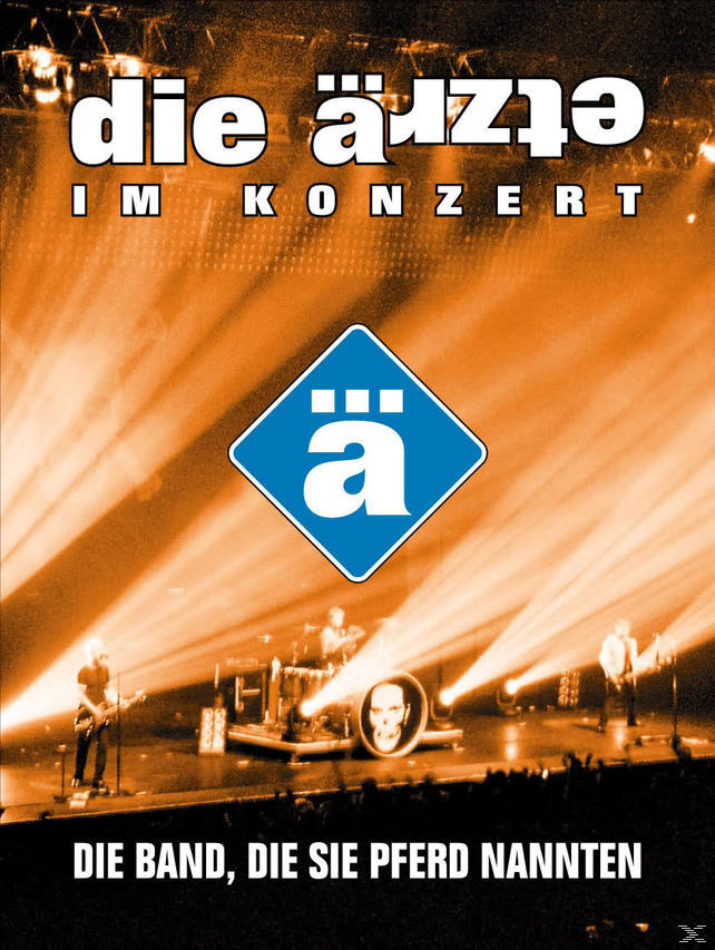 Die Ärzte Konzertplakat. Die Band spielt auf der Bühne mit einem großen Bühnenlicht.