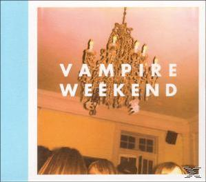 Albumcover für Vampire Weekend. Zeigt einen Kronleuchter und Menschen in einem warm getönten Raum.