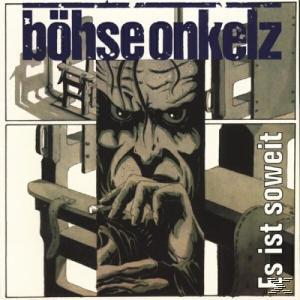 Albumcover mit einem Monstergesicht und industriellem Hintergrund.