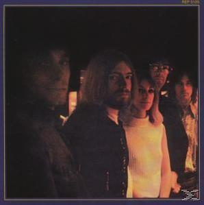Albumcover mit einer Gruppe von Leuten in dunkler Umgebung.