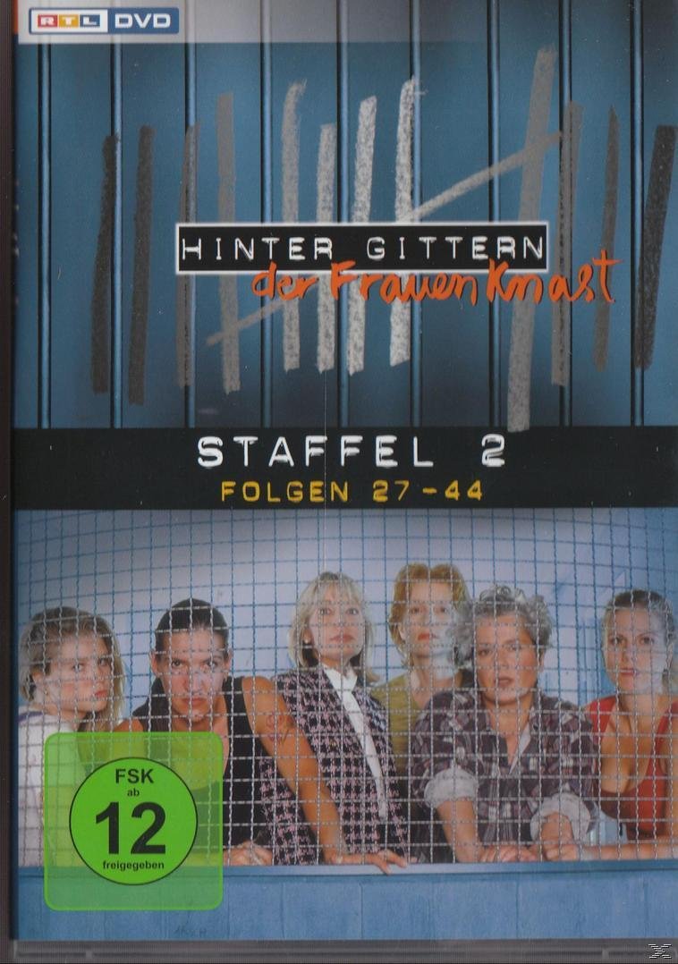 DVD-Cover. Eine Gruppe von Frauen hinter einem Zaun. Der Titel lautet 'Hinter Gittern'.