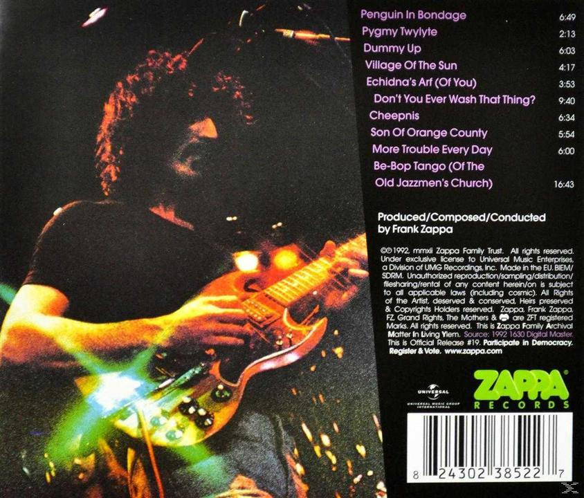 Rückseite einer CD-Hülle mit Text und einem Foto einer Person, die Gitarre spielt, und einem Zappa Records-Logo.