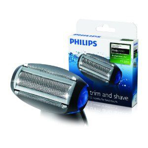 Electric shaver head and replacement cartridge in a box.