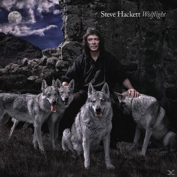 Albumcover. Steve Hackett Wolflight. Mann mit Wölfen, Hintergrund Vollmond.