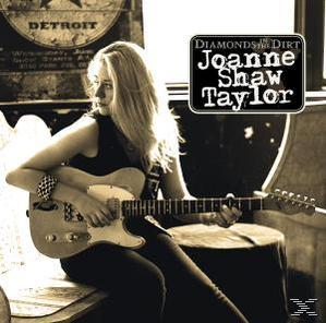 Frau mit Gitarre in Detroit, Text 'Joanne Shaw Taylor'.