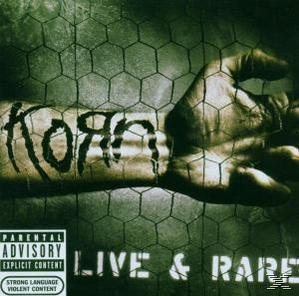 Album borító egy kézzel egy drótkerítésben, a "KORN" szóval és az album címével.