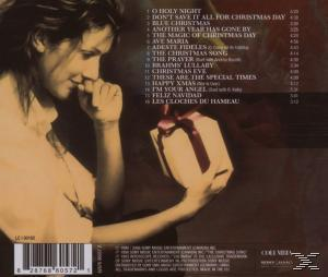 Weihnachts-CD-Rückseite. Eine Frau hält ein Geschenk. Songtitel sind auf der rechten Seite aufgeführt.