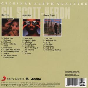 Album-Rückseite mit drei Bildern. Der Text handelt von den Songs und der Künstler ist Gil Scott Heron. Weißer Hintergrund.