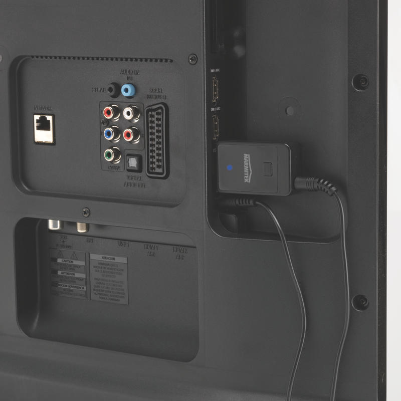 Achterkant van een tv. Zwart, met verschillende verbindingspoorten en een zwart aangesloten apparaat. HDMI-poorten zijn zichtbaar.