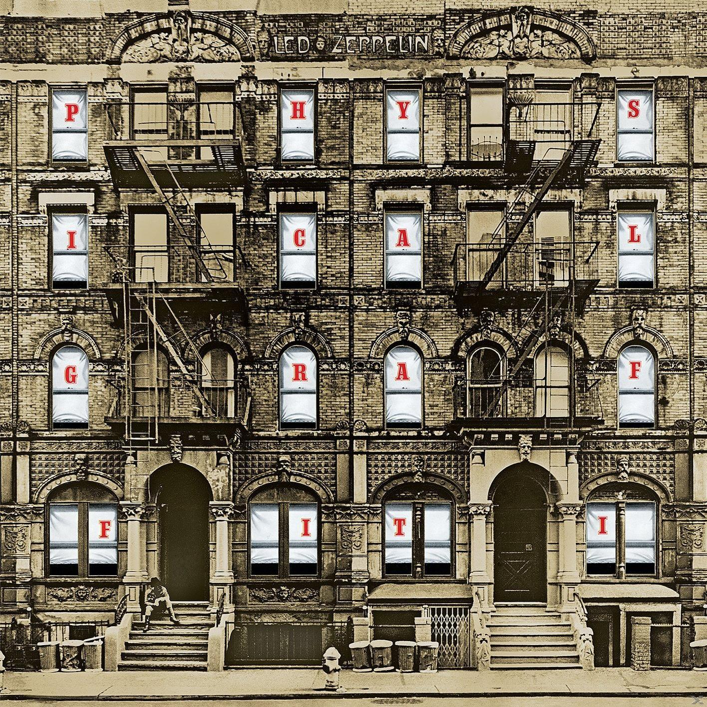 Led Zeppelin Albumcover. Ein Backsteingebäude mit Fenstern, Feuerleitern und einer sitzenden Person.