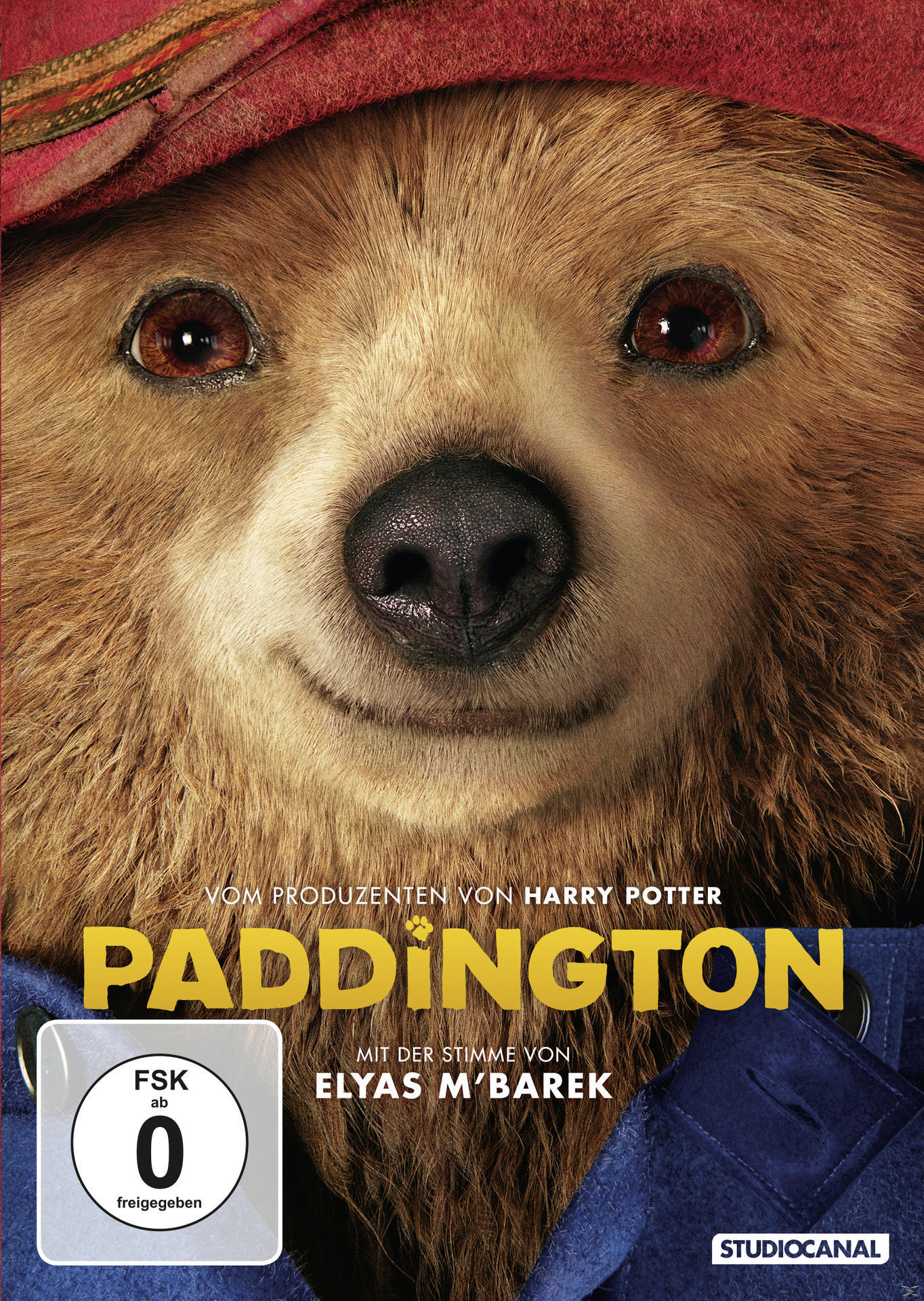 Paddington DVD-Cover. Nahaufnahme von Paddington Bärs Gesicht. Roter Hut und blauer Mantel sind sichtbar.