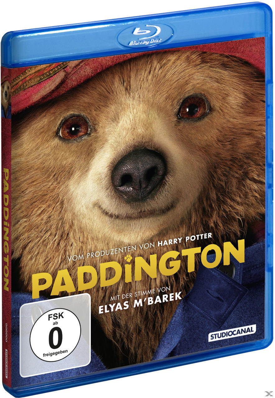 Blu-ray-Cover des Films 'Paddington'. Nahaufnahme von Paddington Bärs Gesicht auf einer blauen Hülle, mit Text.