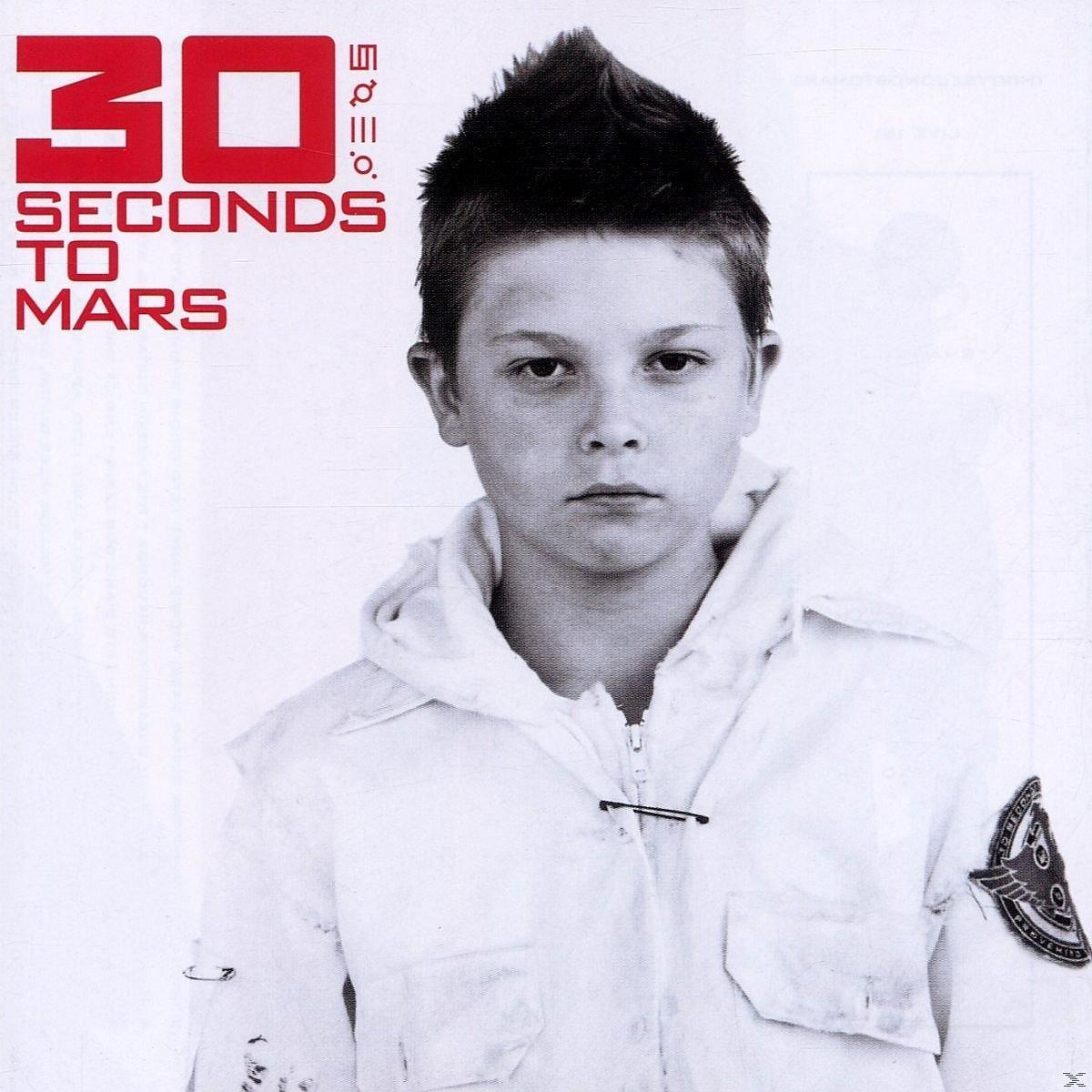 30 Seconds to Mars Albumcover. Junge mit Stachelfrisur in weißer Jacke. Text: 30 Seconds...