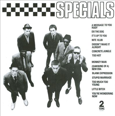 The Specials album borítója, zenekari tagok öltönyben, fekete-fehér kockás háttérrel.