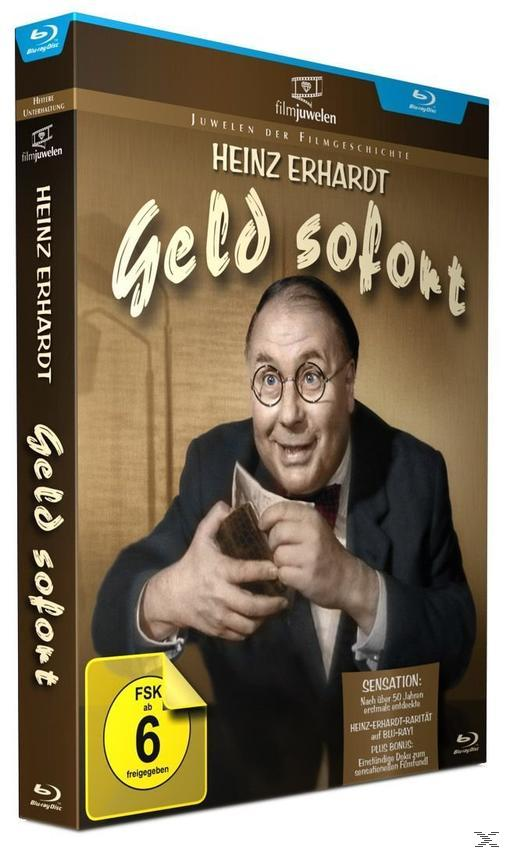 DVD-Box-Art für den deutschen Film 'Geld sofort', mit einem Mann mit Brille, der Karten hält.