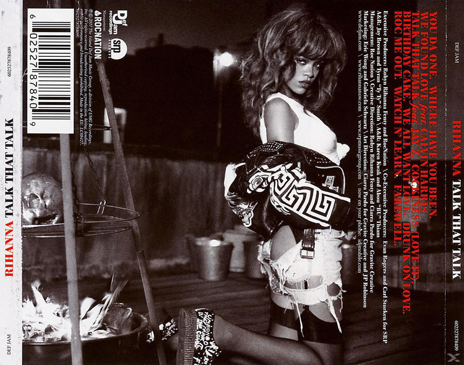 Rihanna Albumcover: Rihanna in weißem Top, schwarzer Jacke und Shorts. Ein Feuerstelle im Hintergrund.