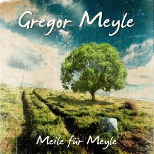 CD-Cover mit einem Baum auf einem Hügel. Grüner Baum, blauer Himmel und Feldweg. Text: Gregor Meyle.