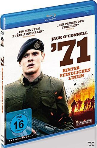 Filmcover: '71, ein Mann mit Barett, hält eine Waffe, mit verschwommenem Hintergrund.