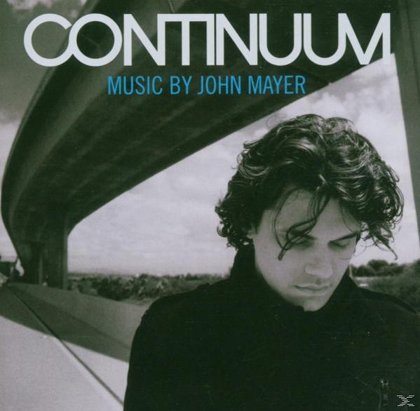 Albumcover für 'Continuum' von John Mayer. Zeigt John Mayer in einem schwarzen Hemd vor einem verschwommenen Brückenhintergrund.