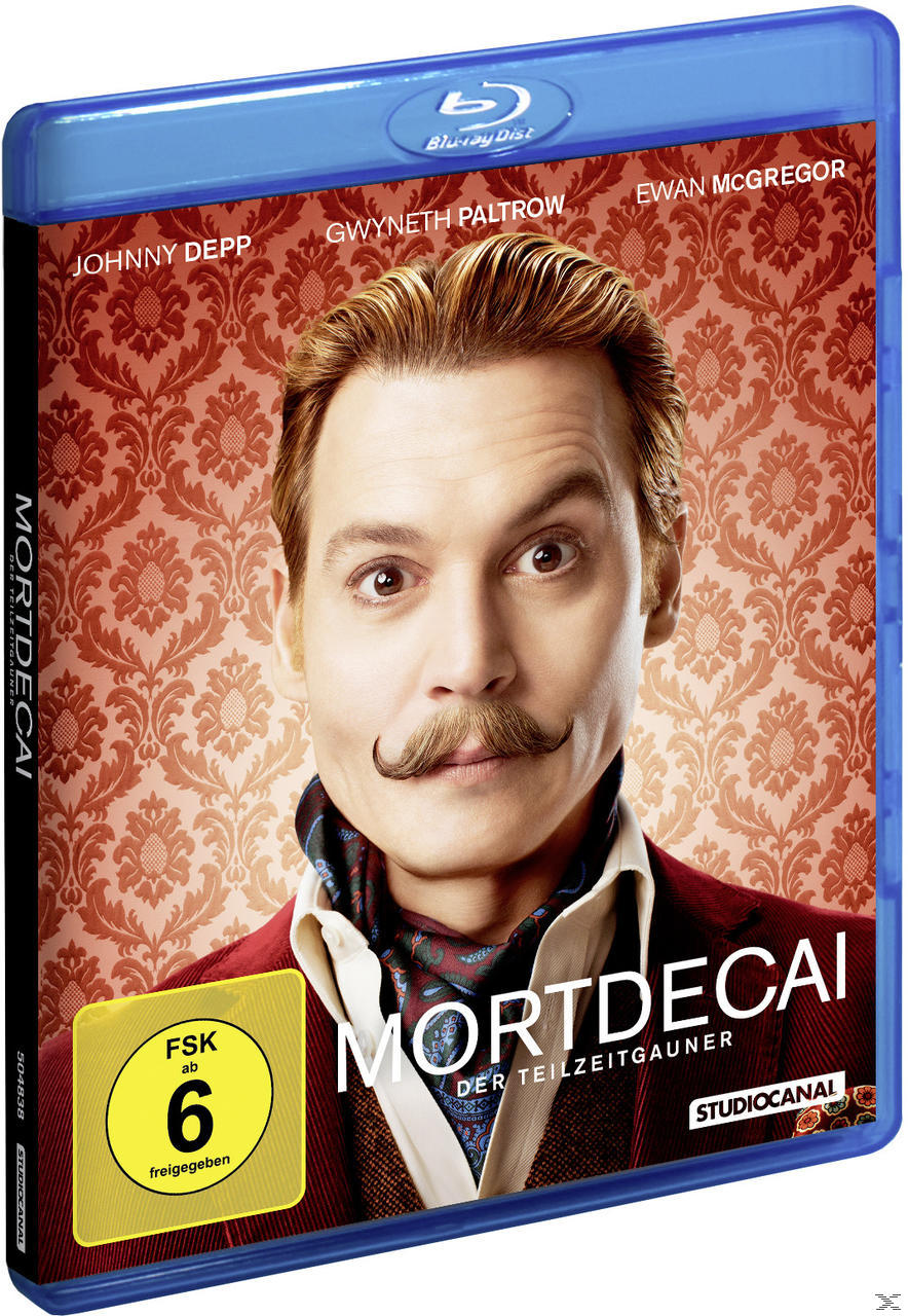 DVD-Cover: Johnny Depp als Mortdecai. Hintergrund: rotes Muster, ein Männergesicht und Text.