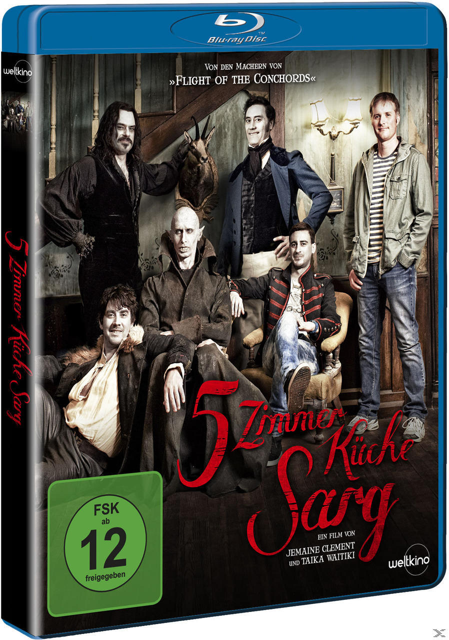 Blu-ray-Cover eines Films mit einer Gruppe von Leuten in einem Raum. Text auf Deutsch.
