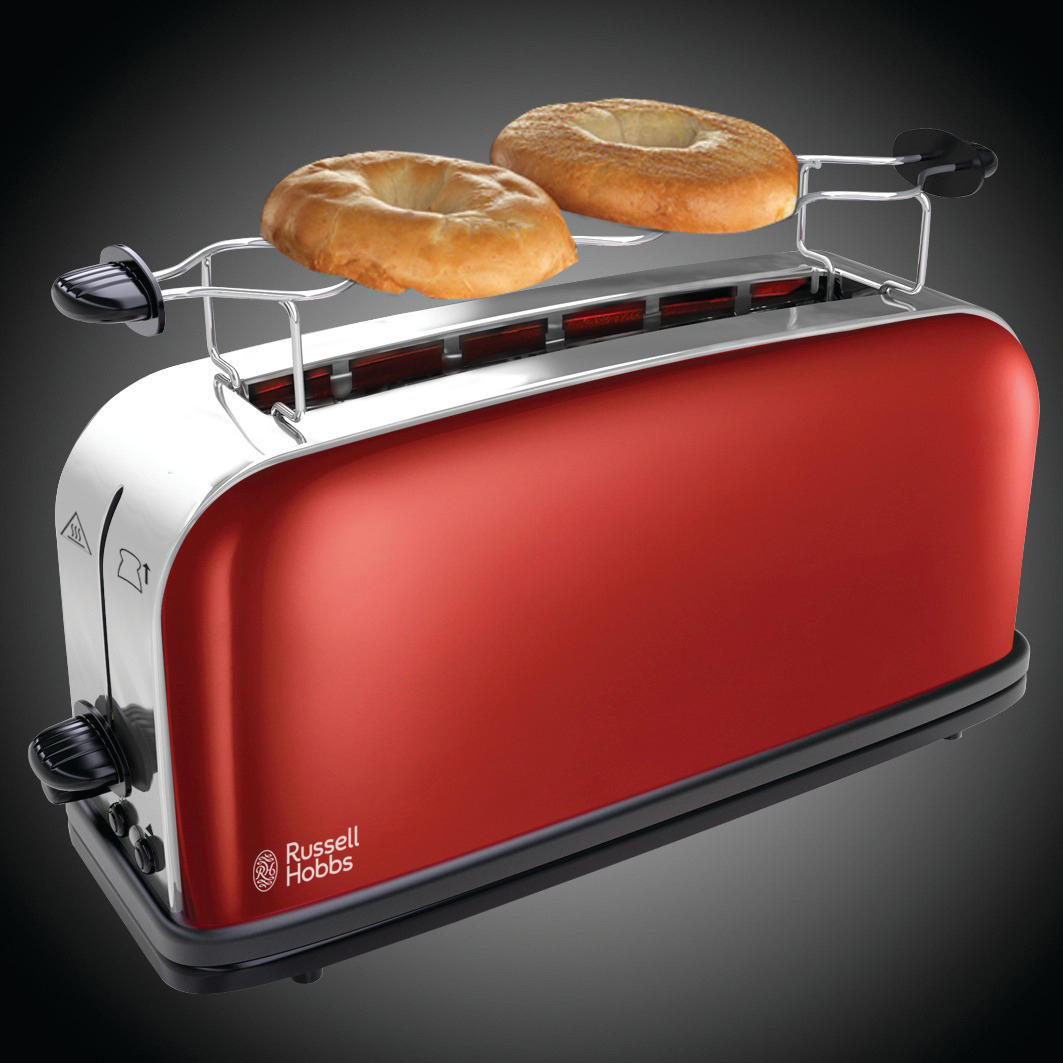 Egy piros kenyérpirító két bagel-lel a tetején. A baglek a pirítós nyílásokban vannak.