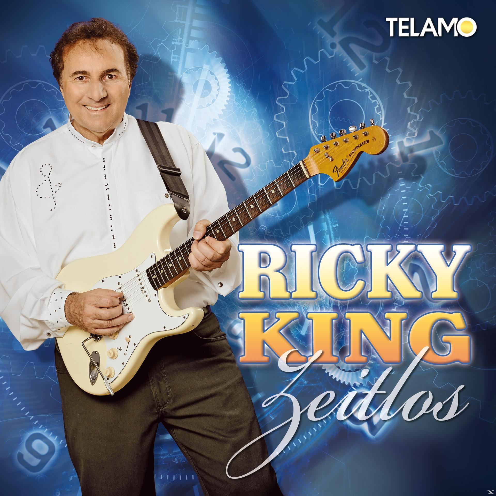 Albumcover: Ricky King mit Gitarre, Titel 'Zeitlos' auf blauem Hintergrund.