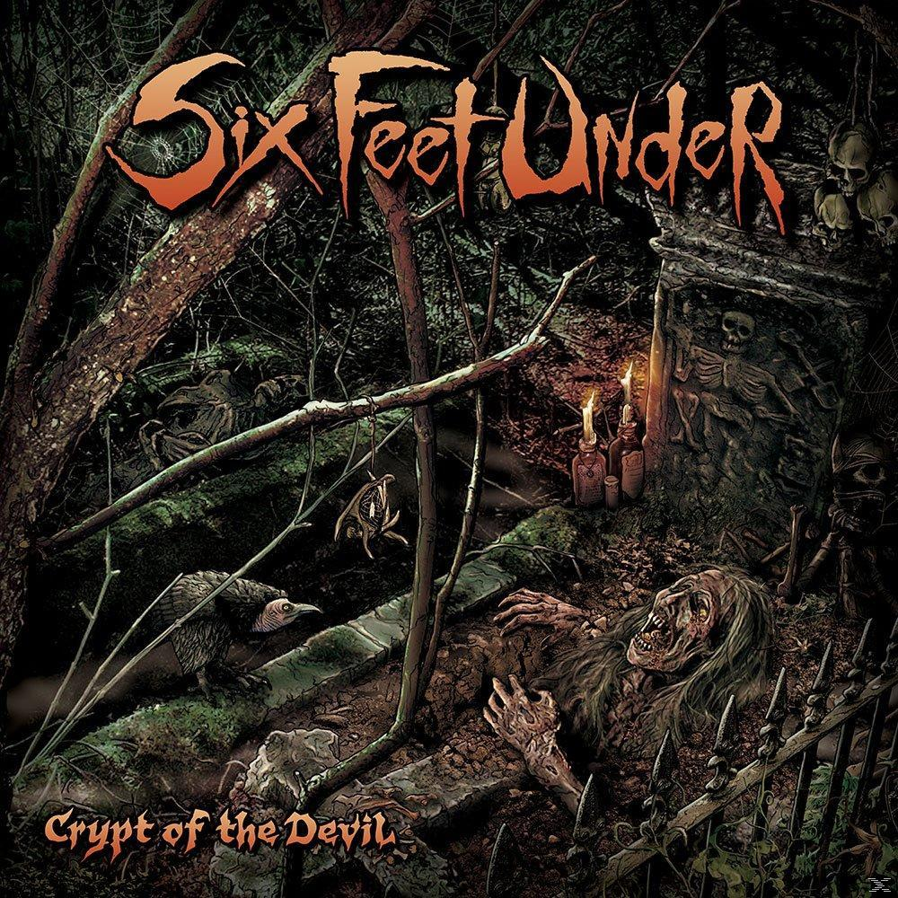 Albumcover für Six Feet Under's Crypt of the Devil. Eine dunkle Waldszene mit einem Grab.