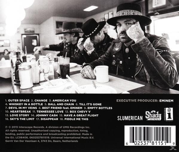 Album-Rückseite in Schwarzweiß. Zeigt drei Männer in einem Diner mit einer Titelliste.