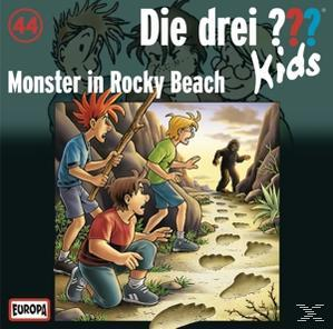Cover für ein Buch mit drei Jungen und einer Kreatur am Strand.