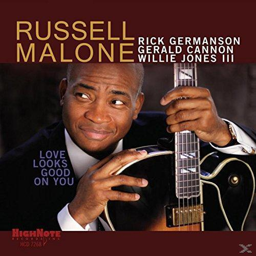 Albumcover: Russell Malone mit Gitarre. Text: Love Looks Good On You. Weitere Namen oben.