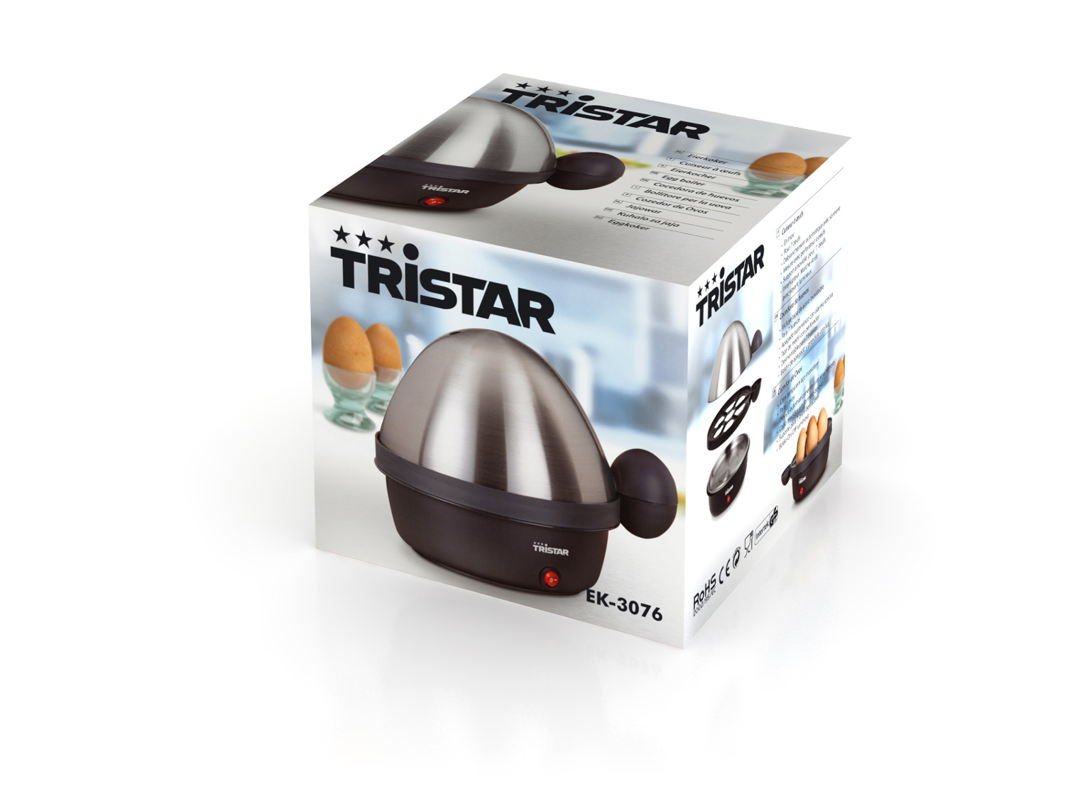 Cuiseur d'œufs Tristar en boîte, avec œufs dans supports et œufs cuits. Argent et noir.