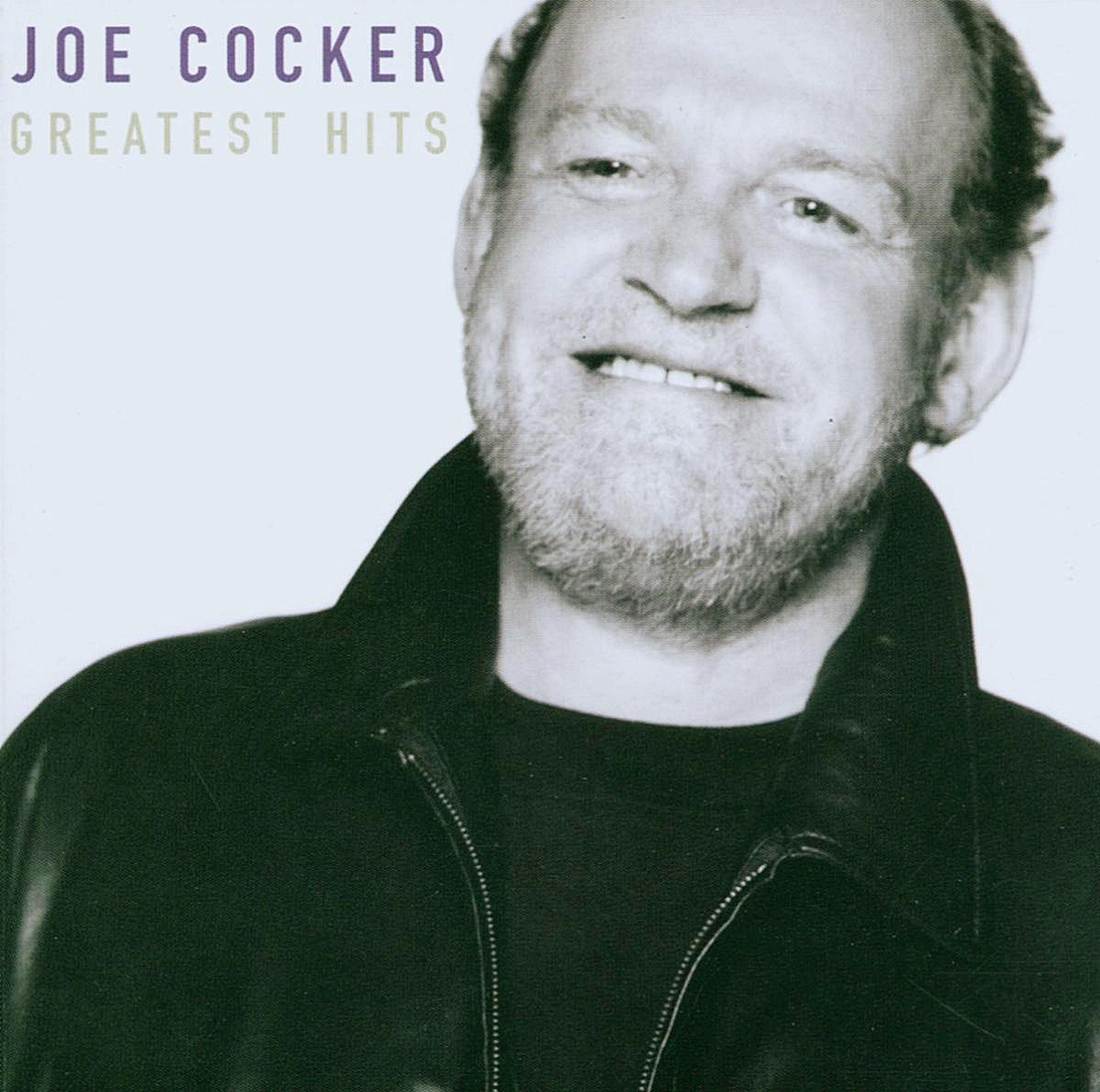 Joe Cocker Albumcover. Ein lächelnder, mittelalter Mann mit Bart. Der Text 'Joe Cocker Greatest Hits' ist sichtbar.