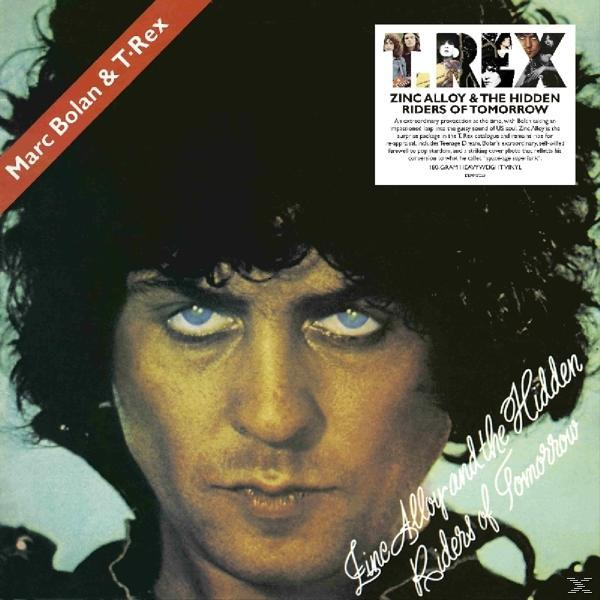 Albumcover: Marc Bolan, T. Rex und Albumtitel in roter Schrift. Dunkelhaariger Mann mit blauen Augen.