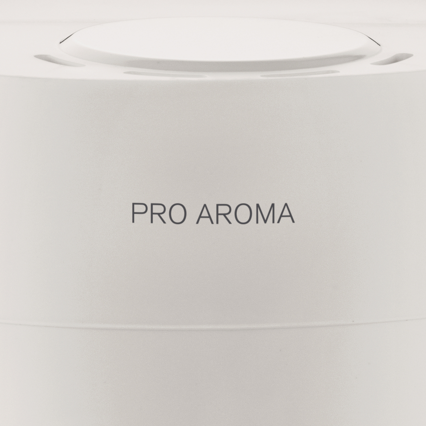 Weißes Gerät mit dem Text 'PRO AROMA' auf der Vorderseite.