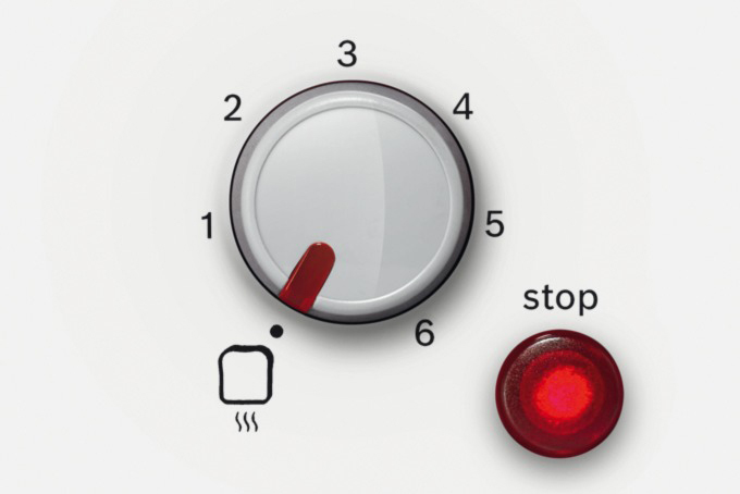 Ein Toaster-Bedienfeld. Es hat ein Zifferblatt mit Zahlen, eine rote Anzeige und eine Stopptaste. Ein Toastsymbol ist ebenfalls vorhanden.