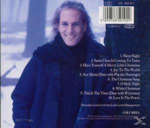 Férfi fekete kabátban, mosolyogva, egy karácsonyi album borítóján. Olyan dalokat sorol fel, mint a Csendes éj.