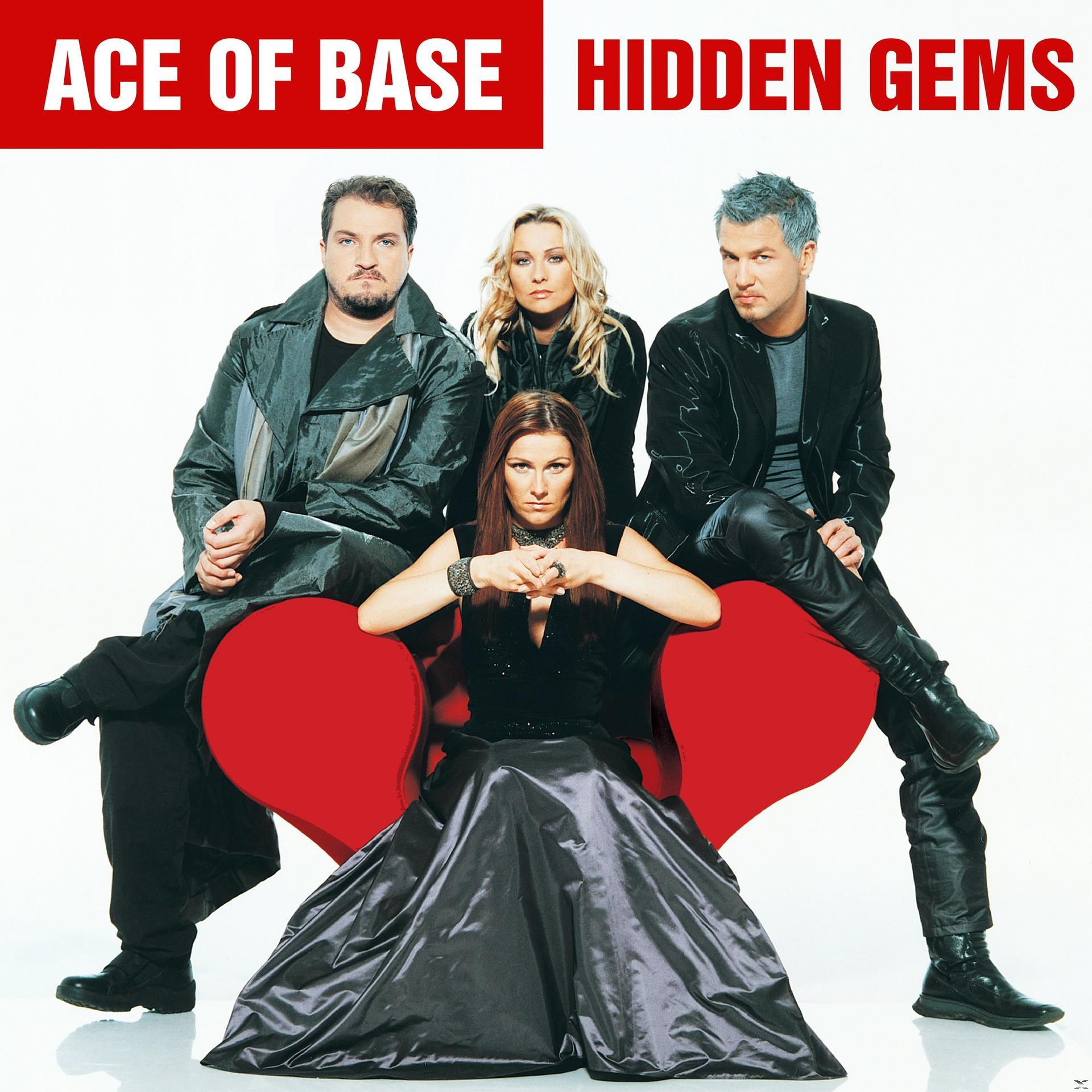 Ace of Base Albumcover. Vier Bandmitglieder posieren vor einem roten Herzen.