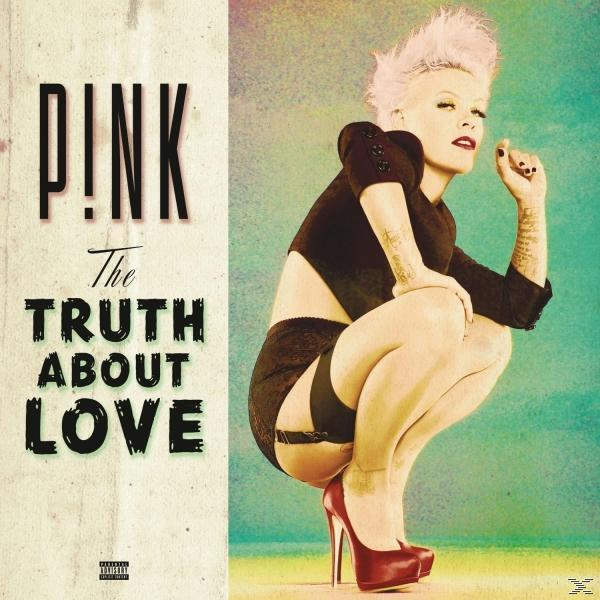Pink Albumcover. Sie hockt, trägt schwarze Kleidung und rote Absätze. Text: P!nk, The Truth About Love.
