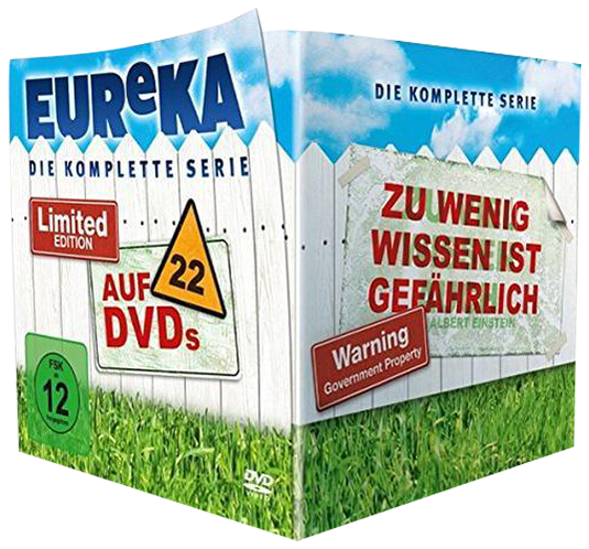 DVD-Box-Set mit Eureka-Serientitel. Enthält 'Limited Edition' und '22 DVDs' Etiketten, vor einem Zaun.