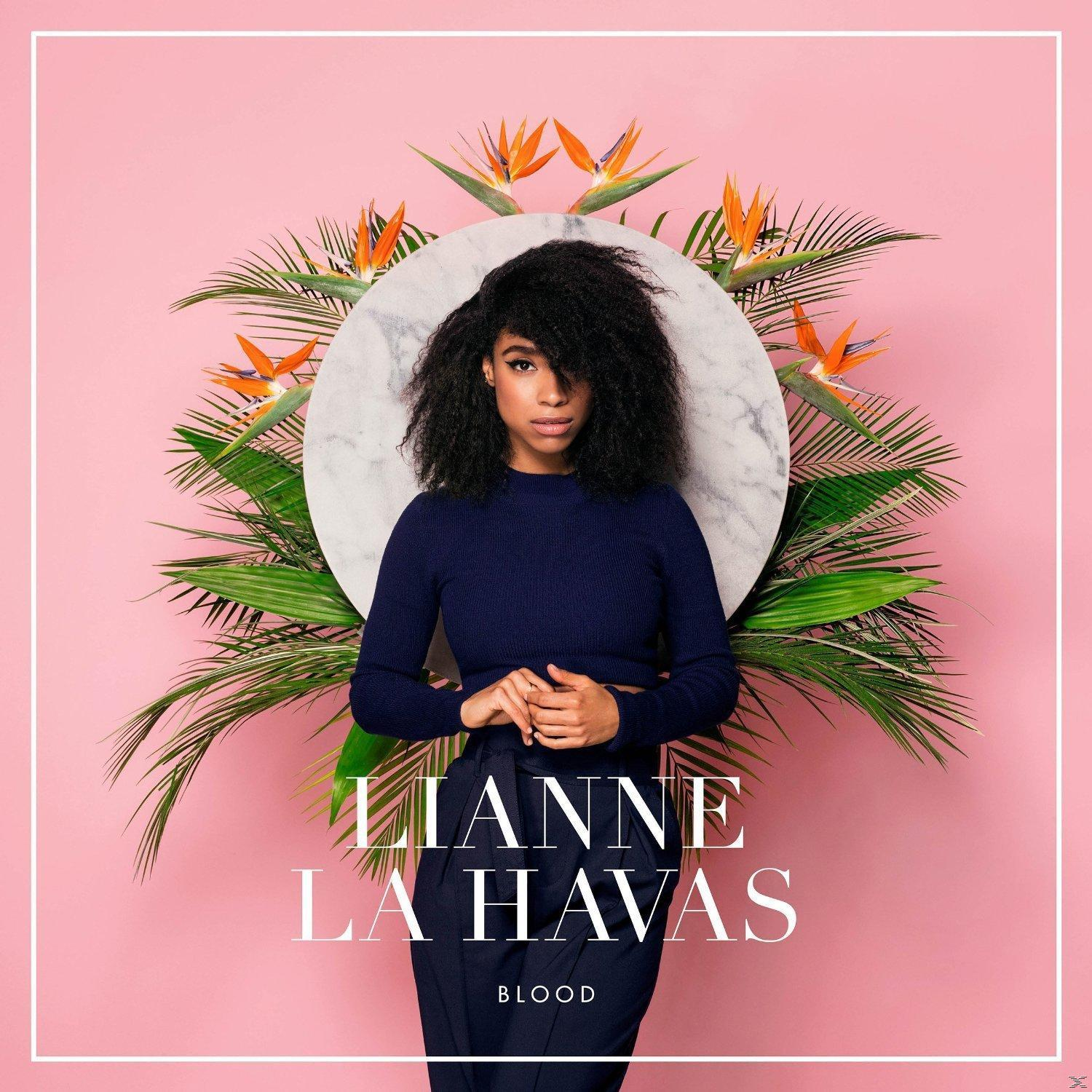 Lianne La Havas 'Blood' albumának borítója, nő, zöld lombokkal.
