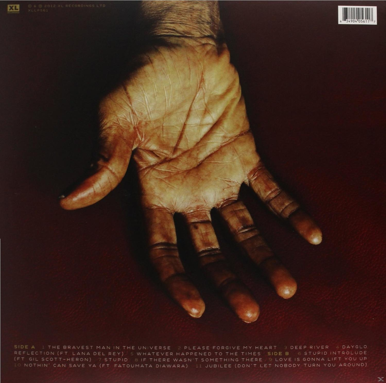 Rückseite des Albums mit Hand, Text und Titelliste.