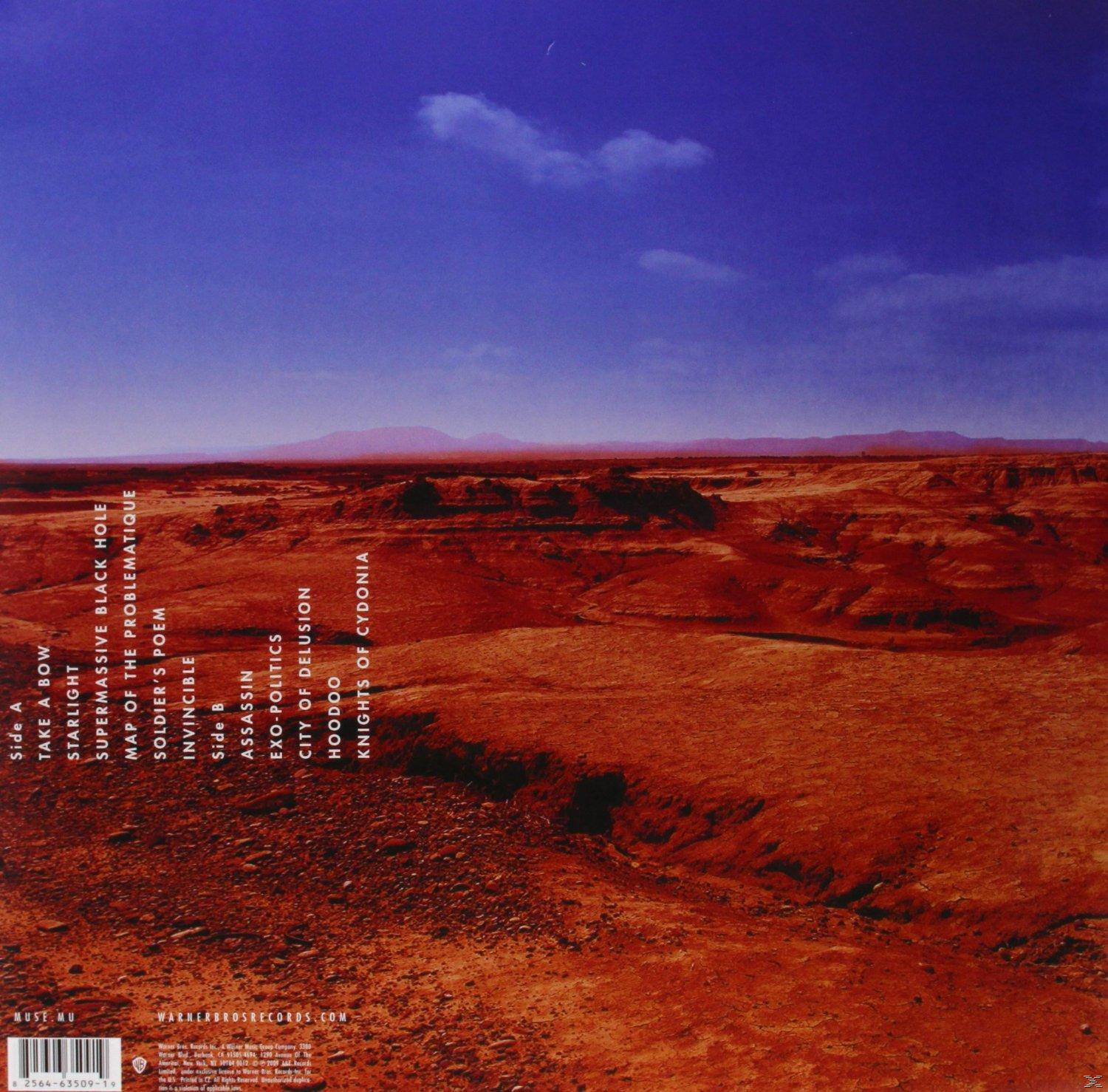 Albumcover mit einer Wüstenlandschaft und blauem Himmel. Text befindet sich auf der linken Seite.