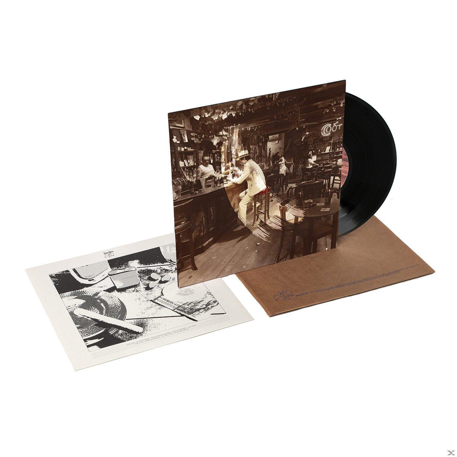 Vinyl-Schallplatten-Albumcover mit einem Foto einer Barszene und einer Schallplatte, sowie einem Einleger. Das Album ist von Led Zeppelin.
